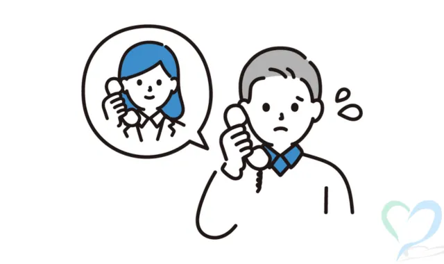 電話で法テラスに相談をする初老の男性